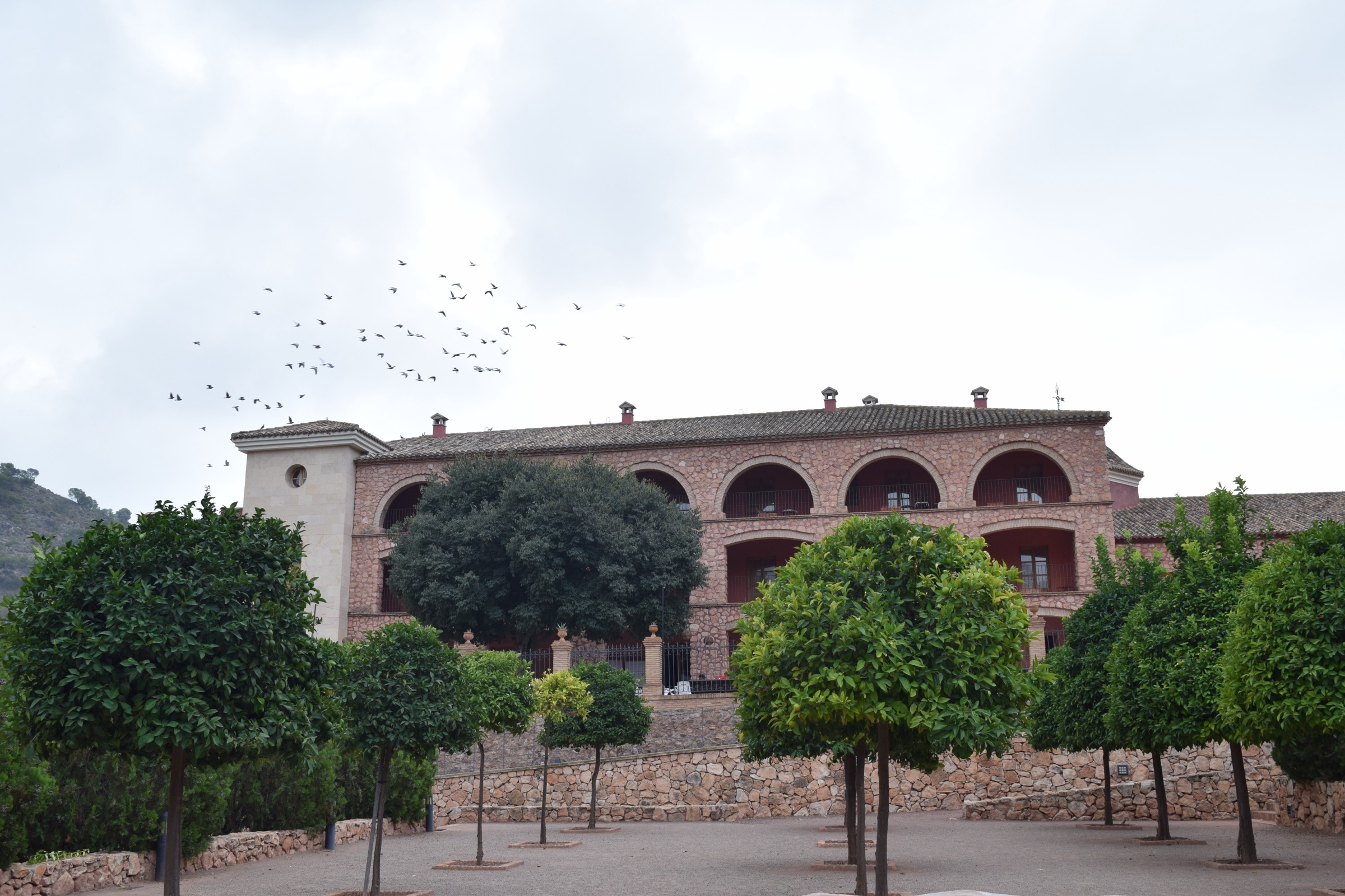 The arched gallery and orange-tree courtyard at the Santuario de Santa Eulalia
