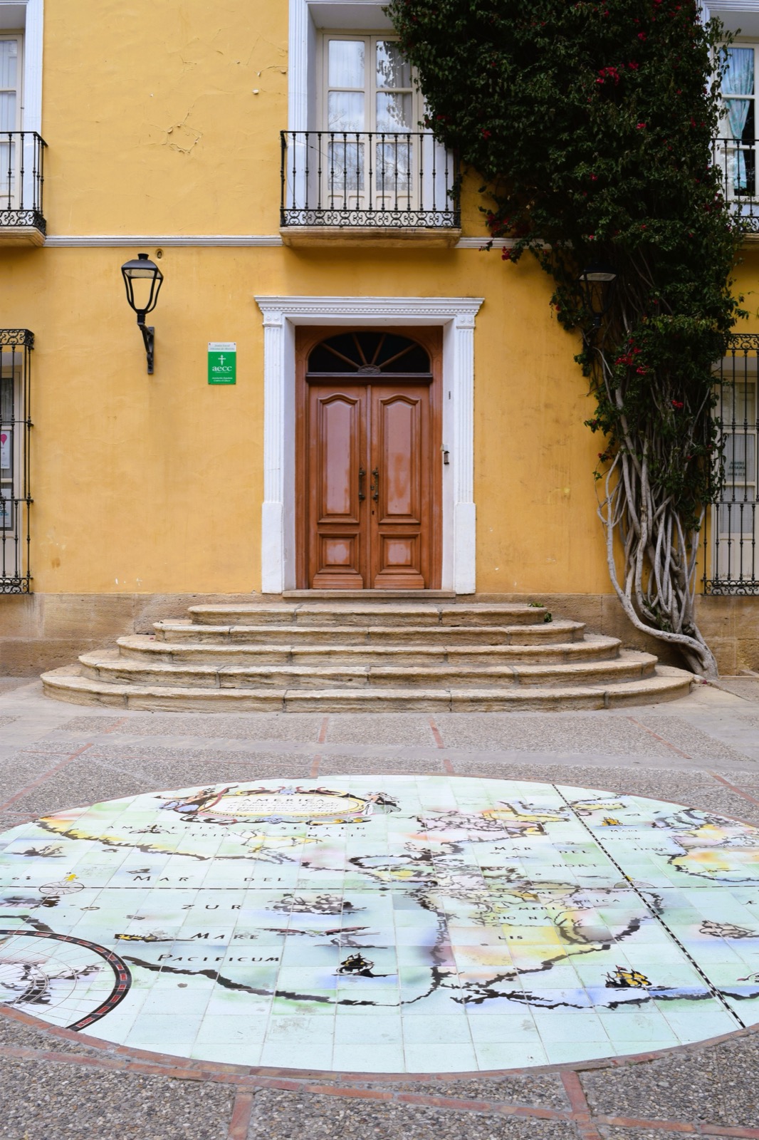 A grand doorway and a tiled map of the coast, Alhama de Murcia