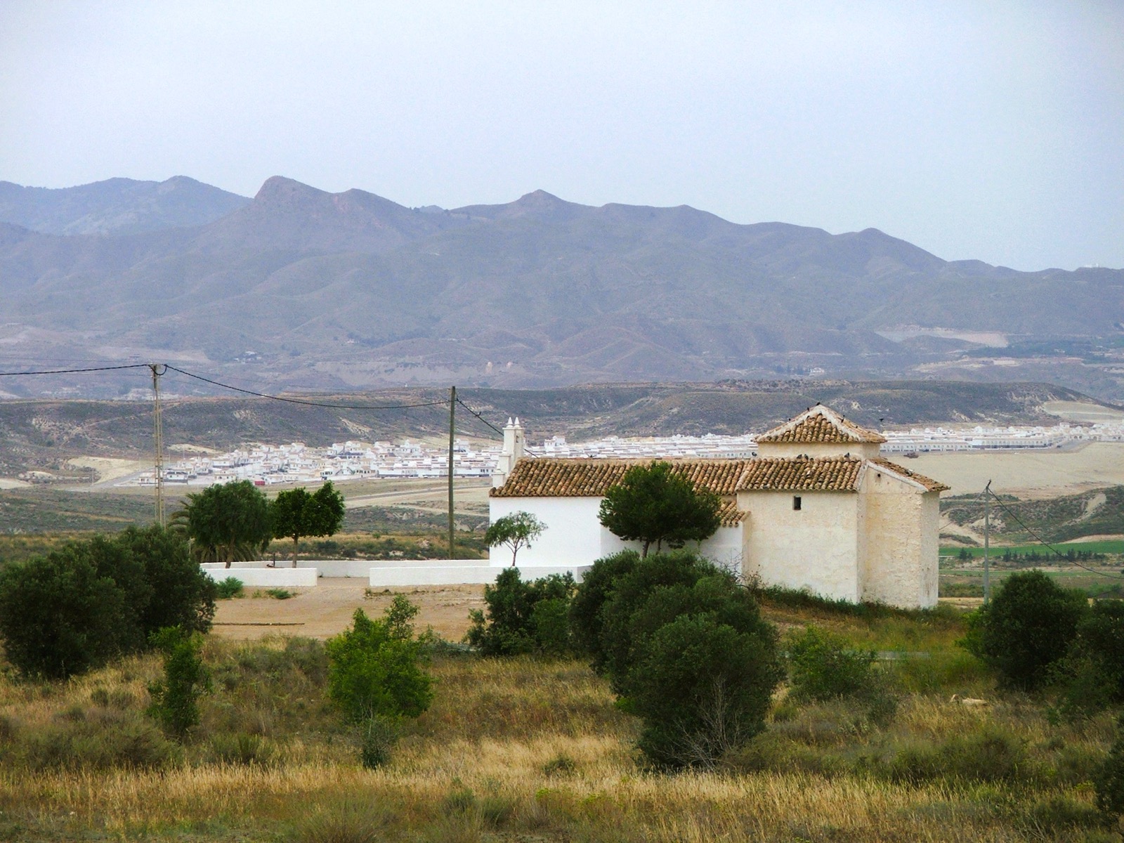 The Iglesia San José at El Saladillo in 2006, with the white villas of Camposol Sector A spread across the plain behind and mountains beyond