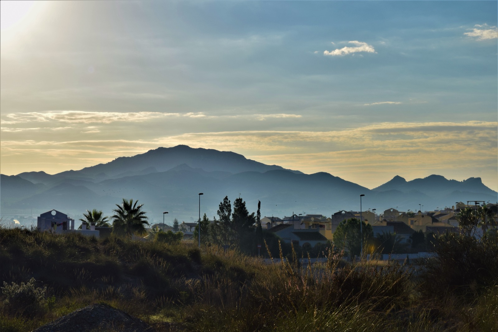 Golden hour over the Lower C sector of Camposol with the mountains behind