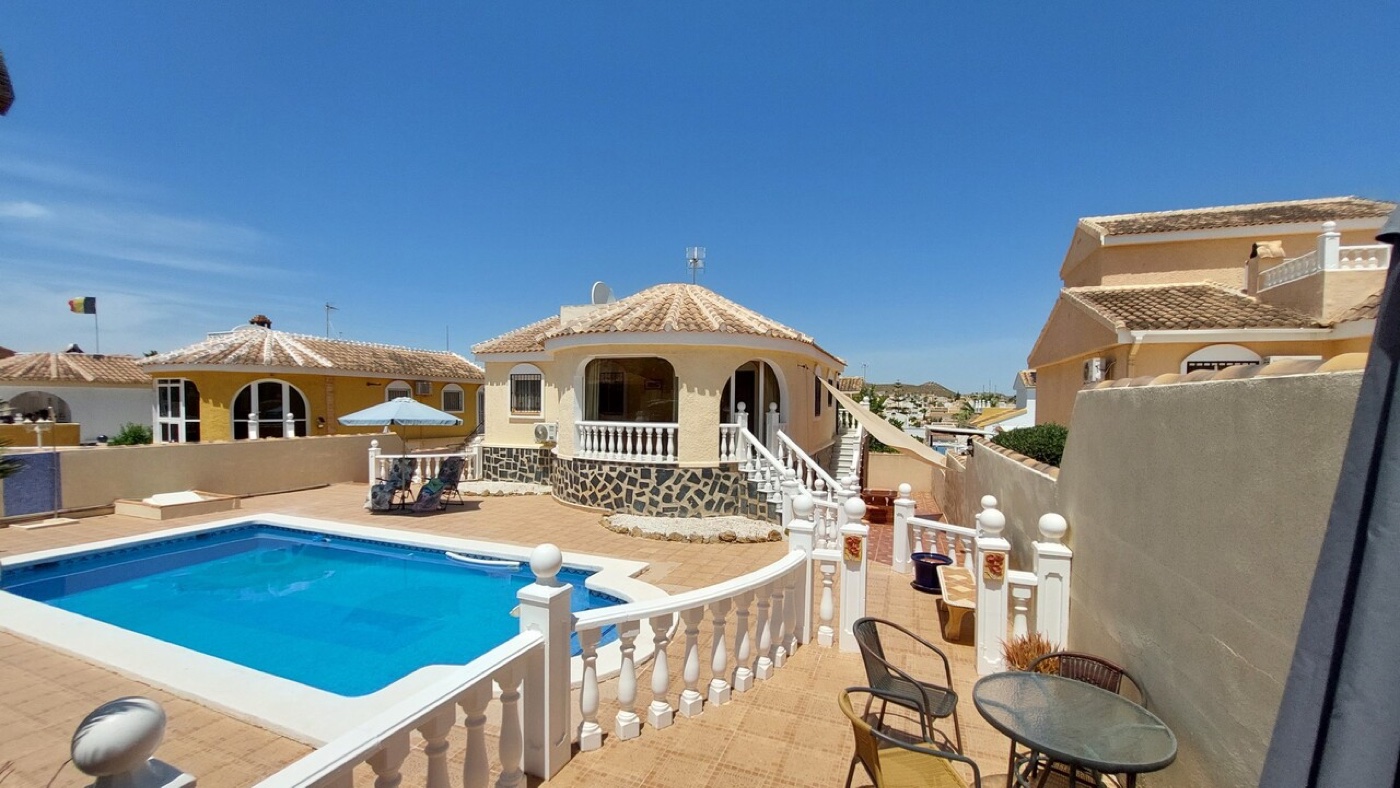 Villa and pool with open views across Camposol