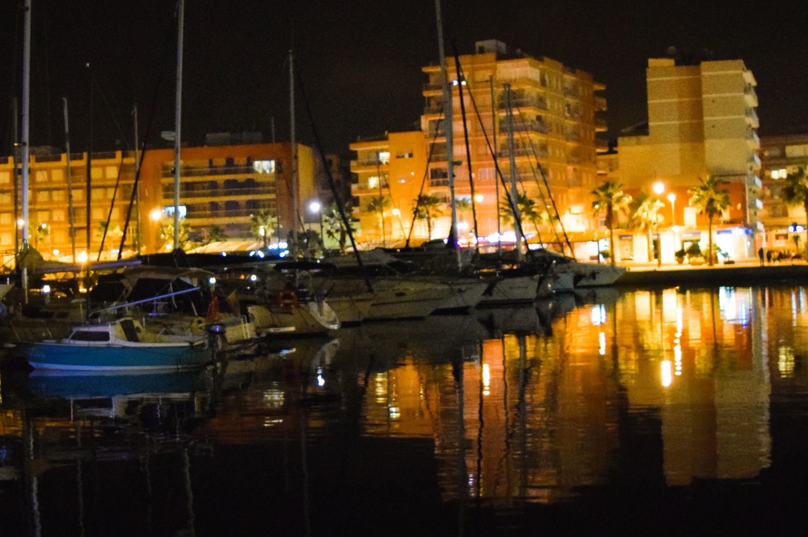 Night reflections of the harbour lights on the water in the marina at Puerto de Mazarrón