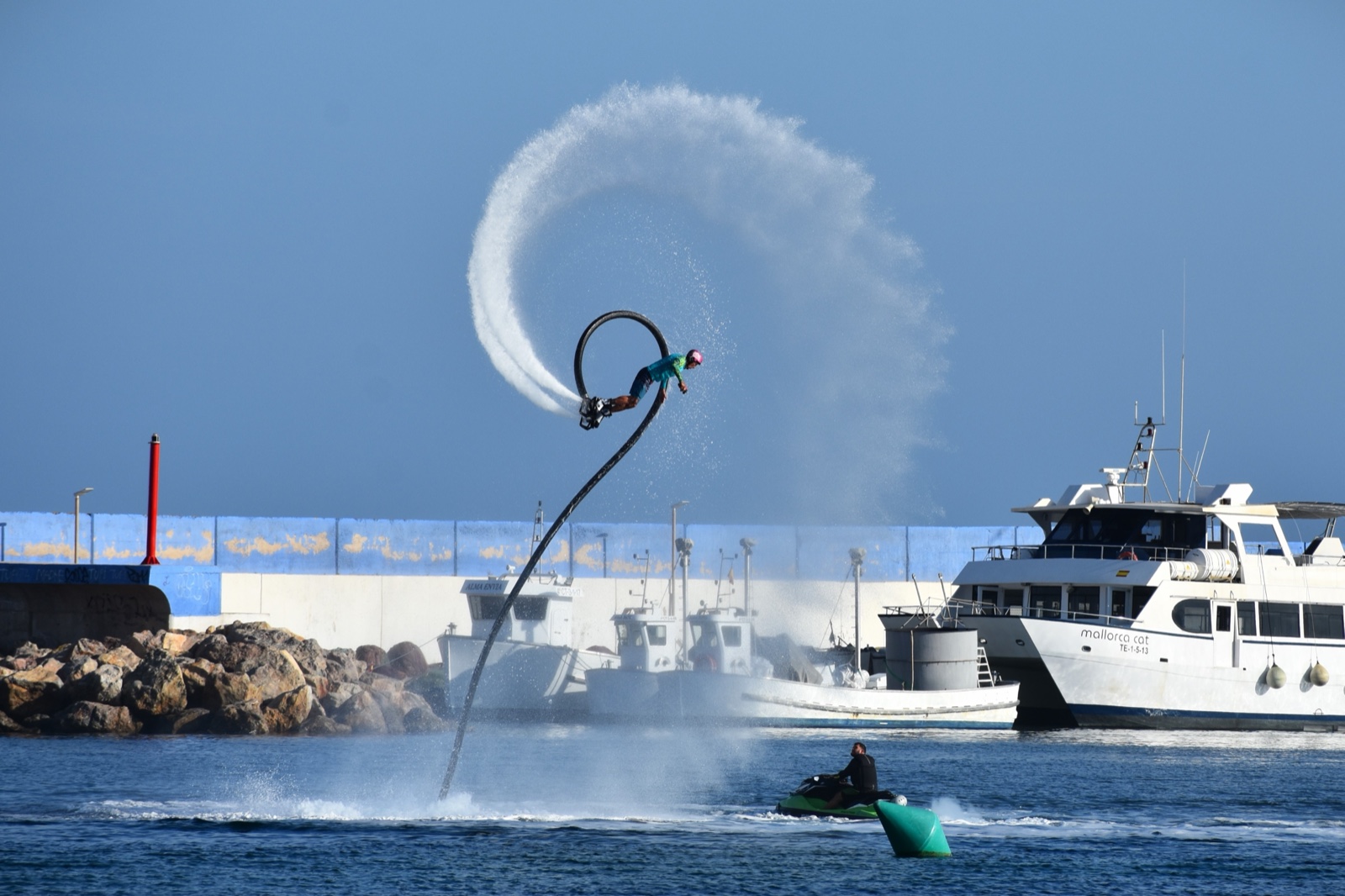 A flyboarder arcing over the harbour at Puerto de Mazarron